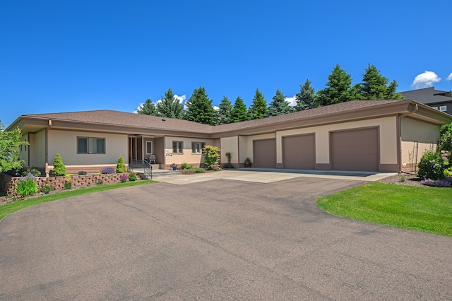 ranch-style house featuring a garage