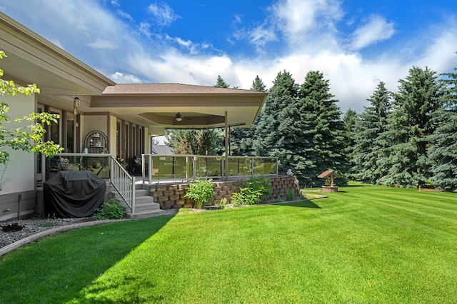 view of yard featuring ceiling fan