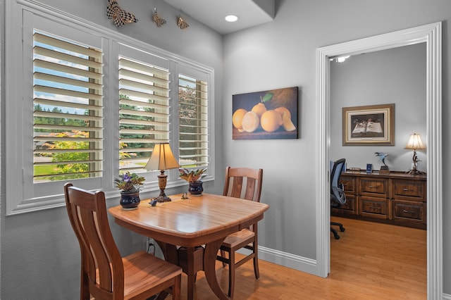 dining room featuring light hardwood / wood-style floors and plenty of natural light