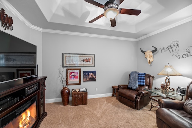 living room with crown molding, light colored carpet, and a raised ceiling