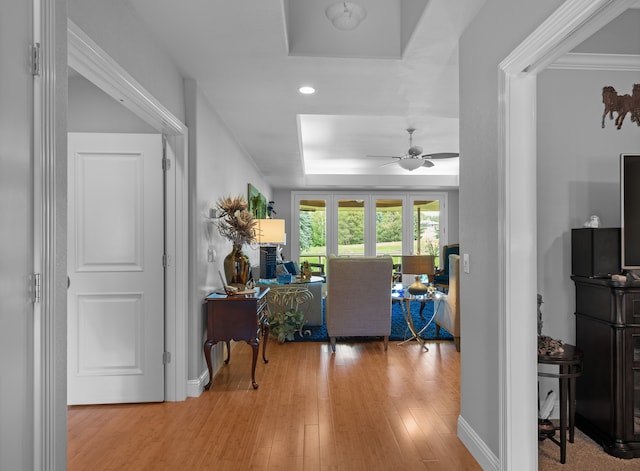 interior space featuring light hardwood / wood-style floors and ceiling fan