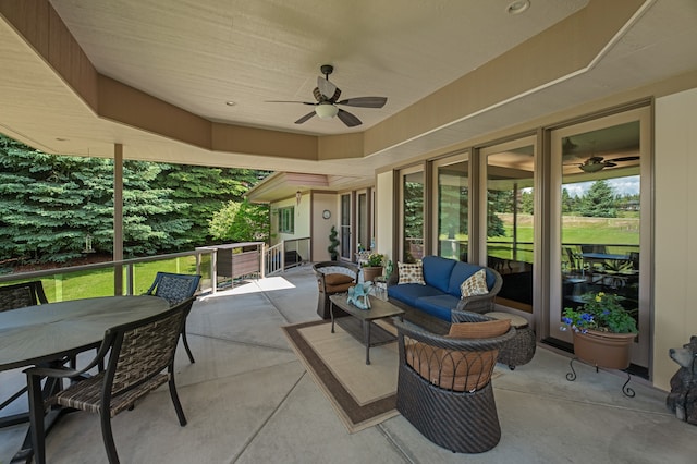 view of patio with outdoor lounge area and ceiling fan