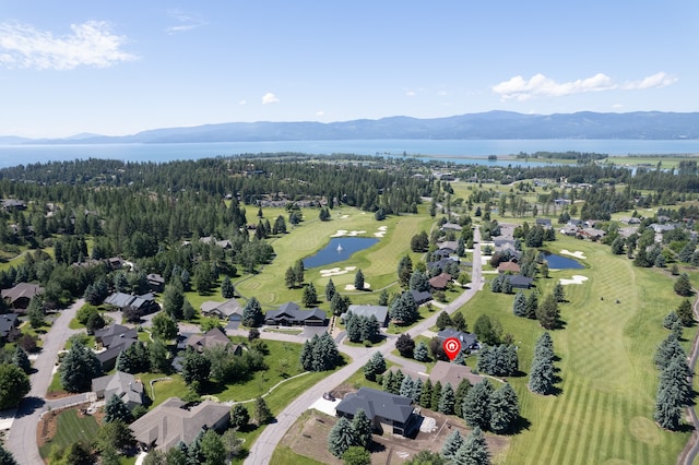 birds eye view of property featuring a water and mountain view