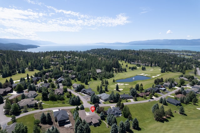 bird's eye view with a water and mountain view