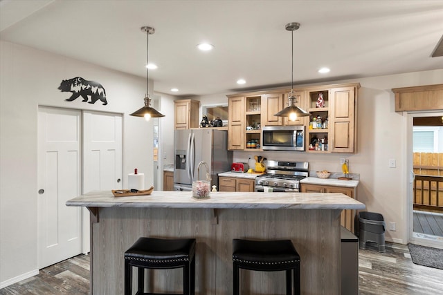 kitchen featuring appliances with stainless steel finishes, open shelves, dark wood-style flooring, a kitchen bar, and recessed lighting