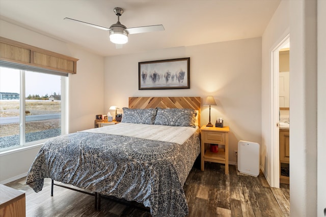 bedroom with dark wood-type flooring and ceiling fan