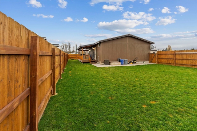 rear view of property featuring a wooden deck and a patio