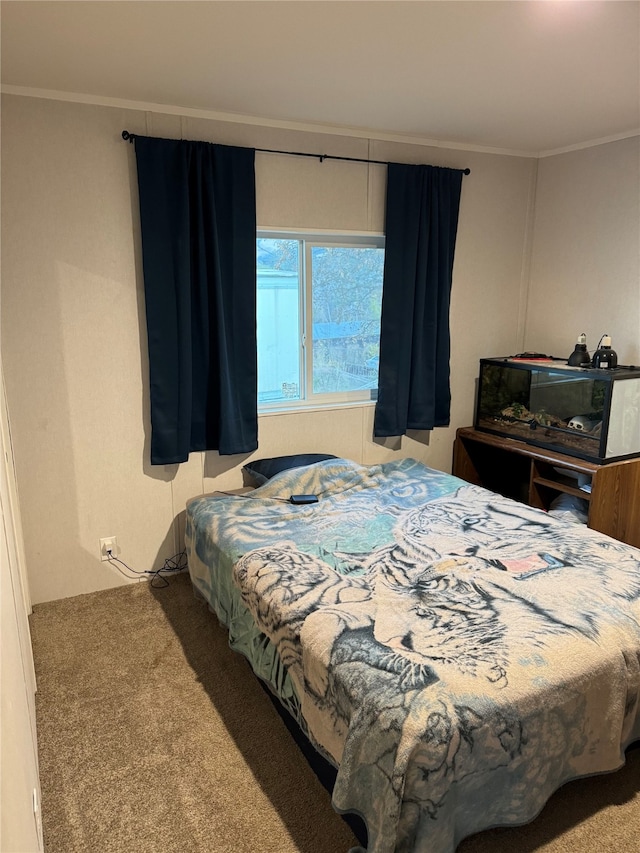 carpeted bedroom with ornamental molding