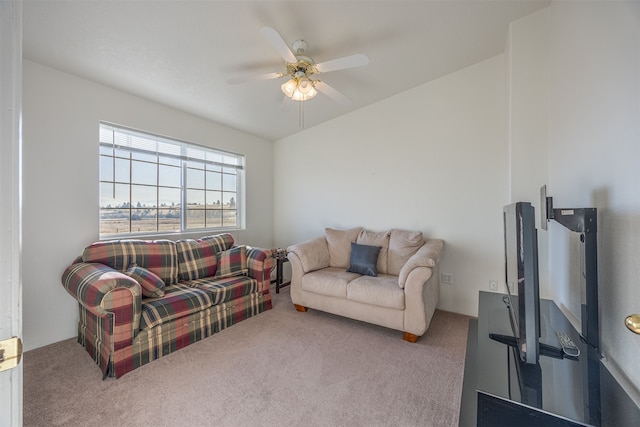 carpeted living room with ceiling fan