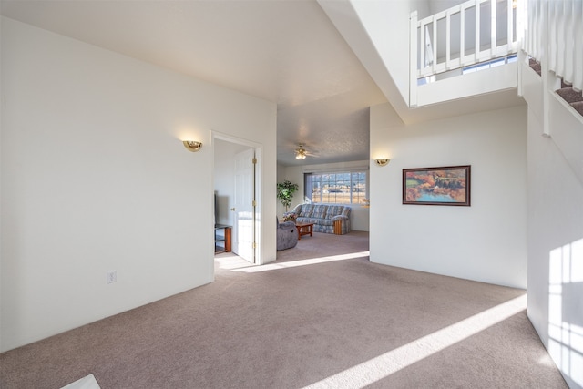 interior space with ceiling fan