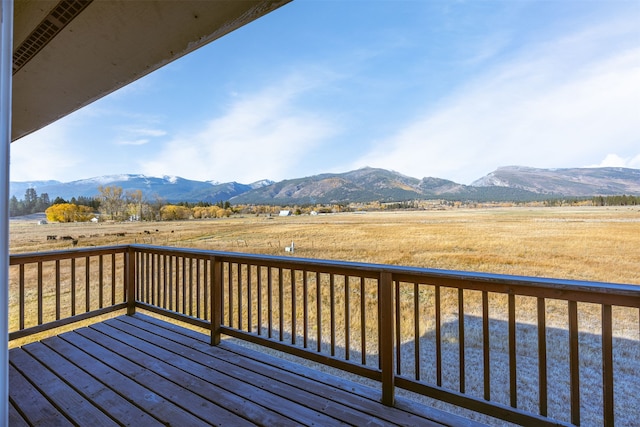 deck with a mountain view and a rural view