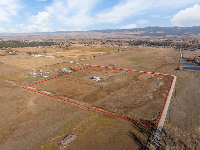 aerial view with a mountain view and a rural view