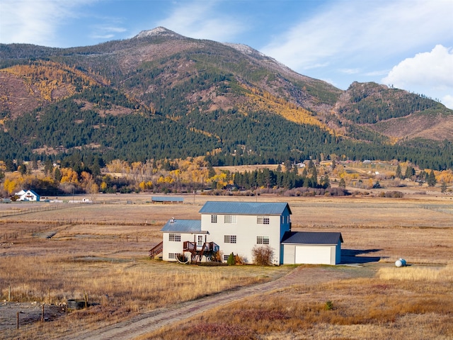 mountain view featuring a rural view