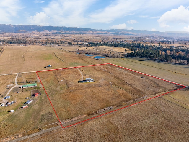 drone / aerial view with a mountain view and a rural view