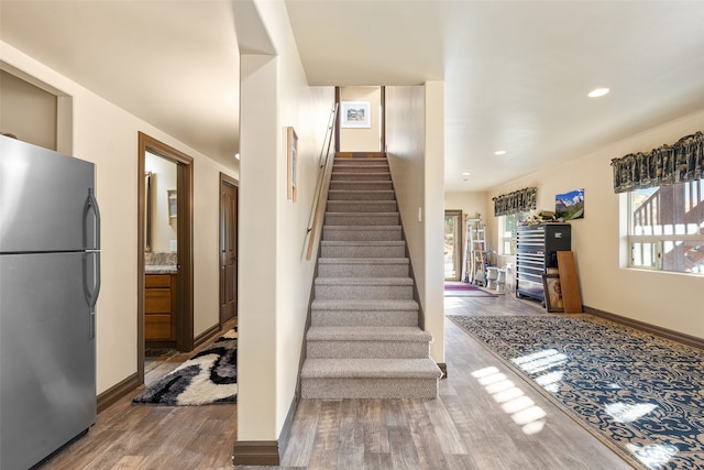 staircase featuring hardwood / wood-style flooring