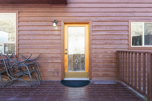 entrance to property with a wooden deck