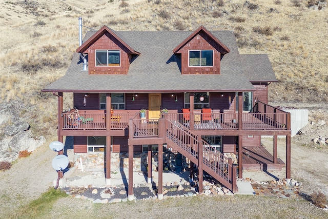 view of front of home featuring a patio and a wooden deck