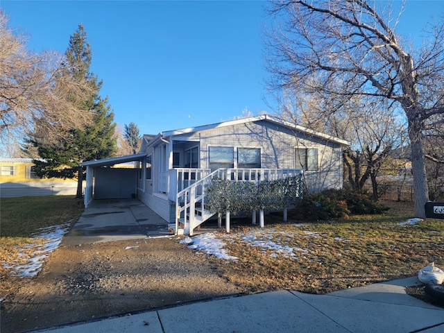 view of front of property with a carport