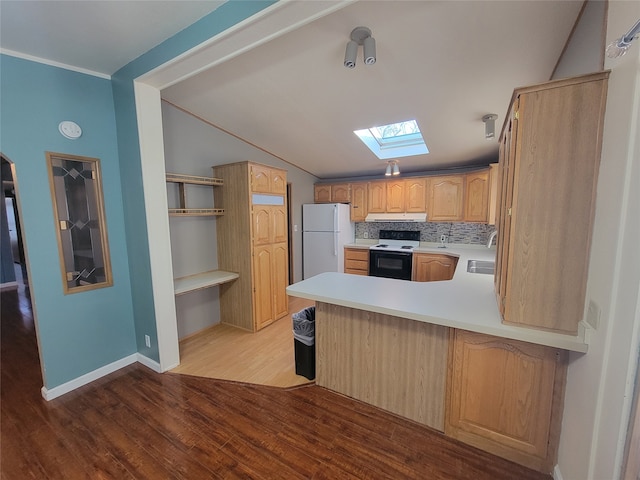 kitchen with kitchen peninsula, light brown cabinets, white appliances, light hardwood / wood-style flooring, and decorative backsplash