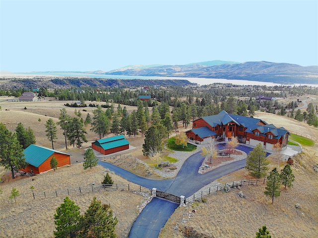 aerial view with a mountain view and a rural view