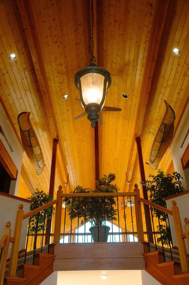 details featuring wood ceiling, ceiling fan, and beam ceiling