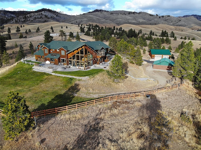 birds eye view of property featuring a rural view and a mountain view