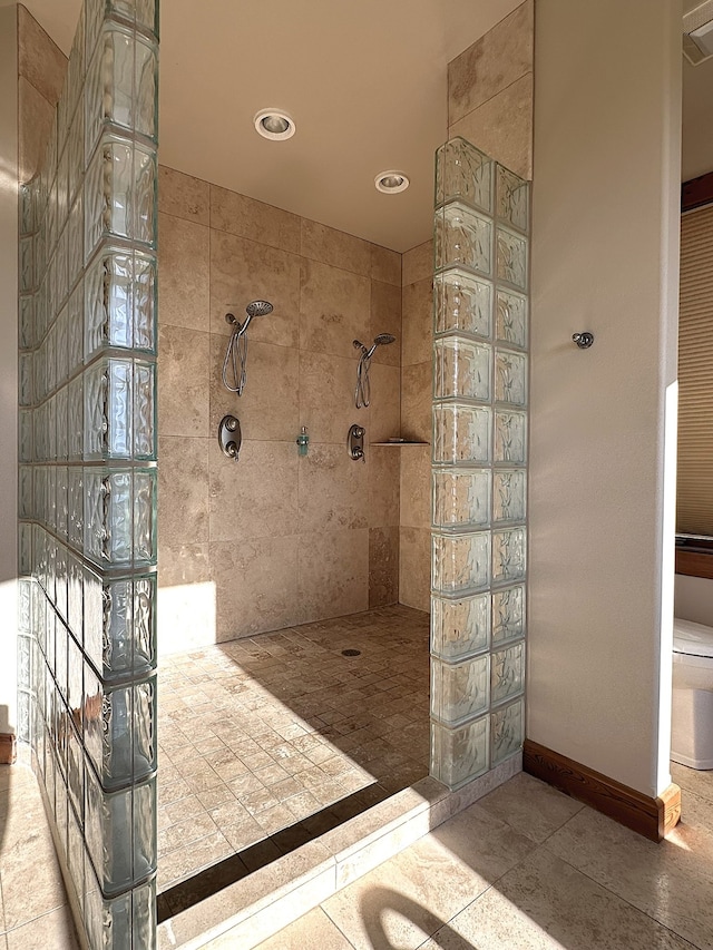 bathroom with tiled shower