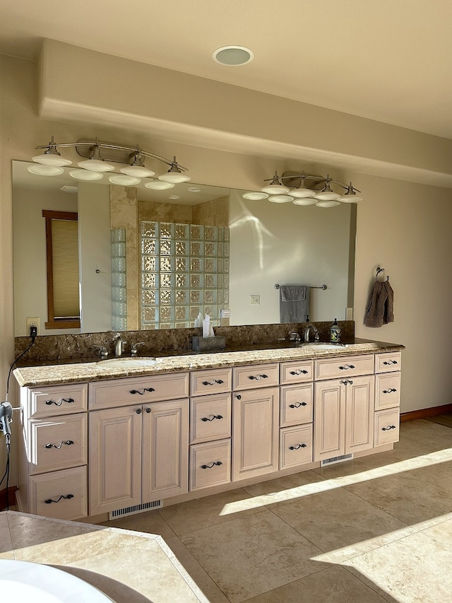 bathroom with vanity and tile patterned floors