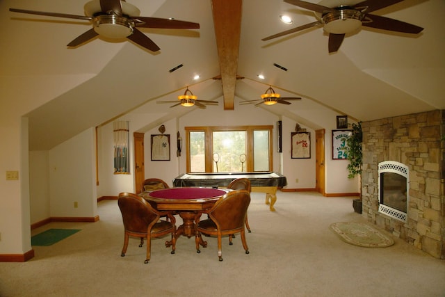 carpeted dining space with lofted ceiling with beams, a fireplace, ceiling fan, and heating unit