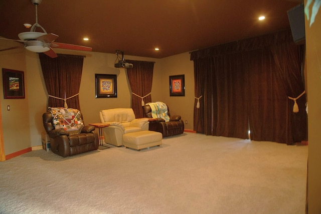 home theater featuring carpet and ceiling fan