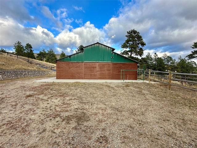 view of outdoor structure featuring a rural view