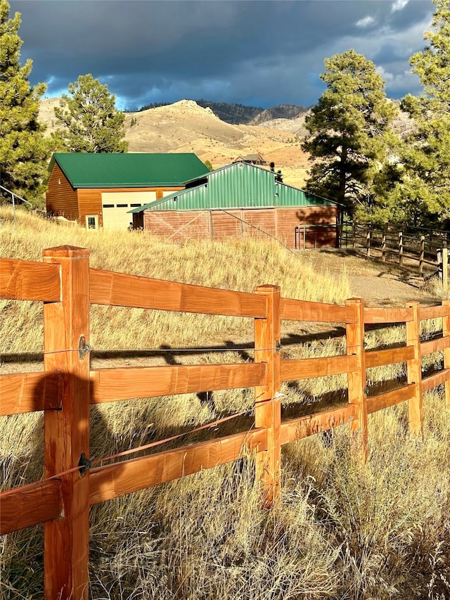 view of gate featuring a mountain view and a rural view