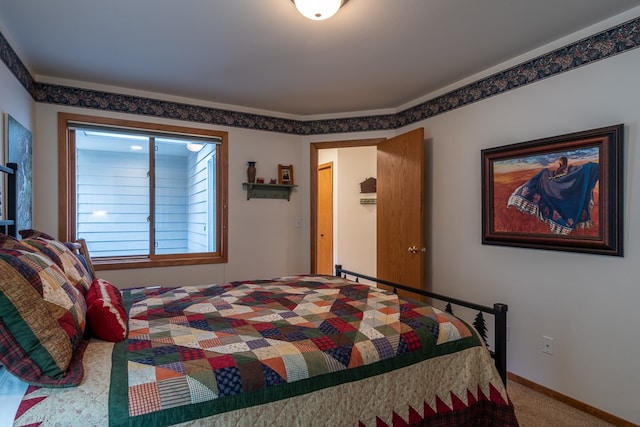 bedroom with carpet floors and ornamental molding