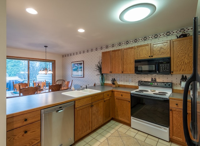 kitchen with white range with electric stovetop, pendant lighting, sink, stainless steel dishwasher, and kitchen peninsula