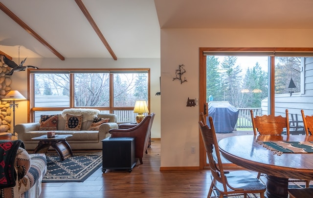 living room with lofted ceiling with beams and dark wood-type flooring