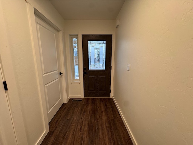 doorway to outside with dark hardwood / wood-style flooring