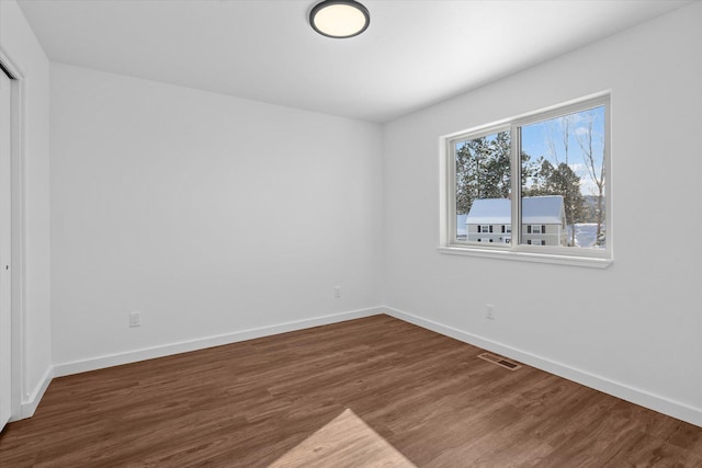 unfurnished bedroom with wood-type flooring