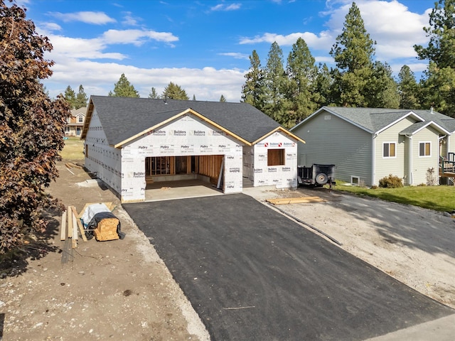 view of front of house featuring an outdoor structure and a garage