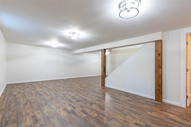 basement featuring dark hardwood / wood-style flooring