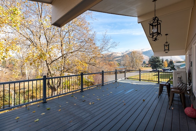 wooden deck with a mountain view