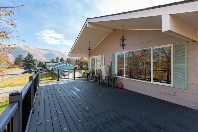 wooden deck featuring a mountain view