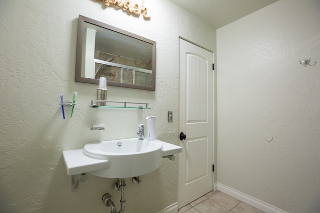 bathroom featuring tile patterned floors and sink