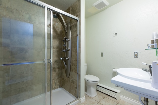 bathroom featuring sink, a baseboard radiator, tile patterned flooring, toilet, and a shower with shower door