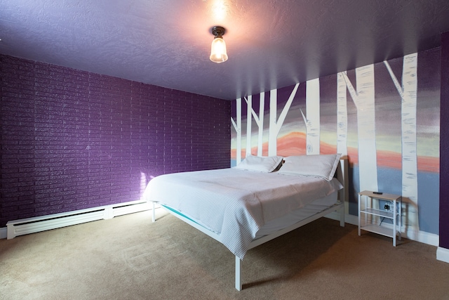 bedroom with carpet, a textured ceiling, brick wall, and a baseboard radiator