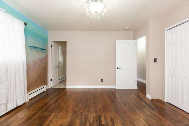 unfurnished bedroom featuring a chandelier, a closet, dark hardwood / wood-style flooring, and a baseboard radiator