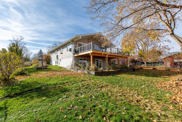 back of property with a lawn and a wooden deck