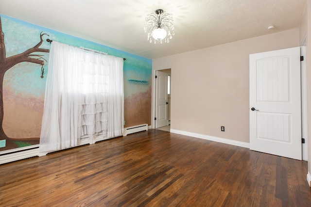 unfurnished bedroom with baseboard heating, dark wood-type flooring, a textured ceiling, and a notable chandelier