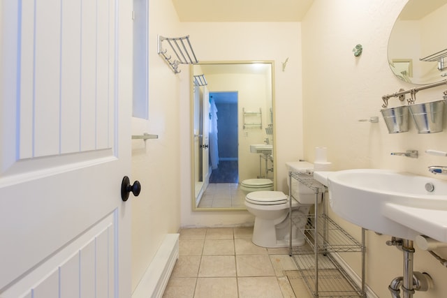 bathroom with tile patterned flooring and toilet