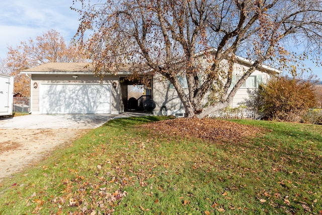 exterior space featuring a garage and a front lawn