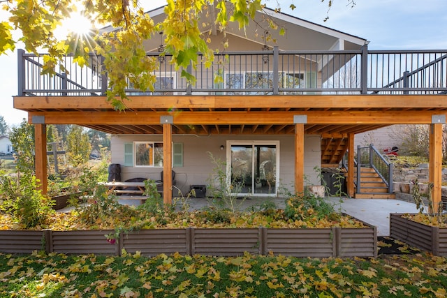 rear view of property with a patio area and a deck